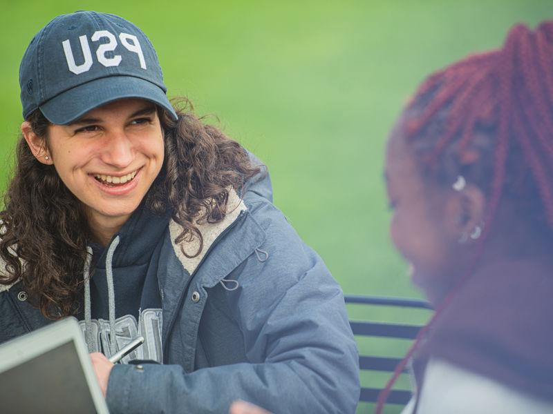 Two female students talking to each other